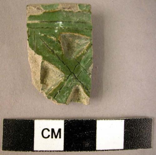 Rim potsherd- green glazed and incised