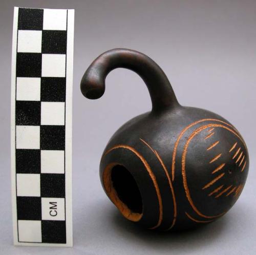 Black burnished gourd with incised decoration