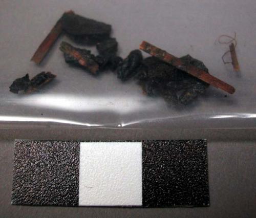 Resin and wood fragments from resin covered quivers