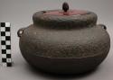 Iron vessel with enameled lid and handles