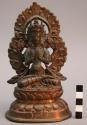 Brass figure of four-armed boddhisatva sitting cross legged
