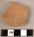 Incised potsherd