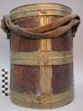 Stout milk bucket of dark wood bound with brass rings