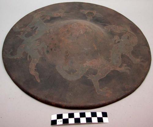 Steel shield with incised dragon designs