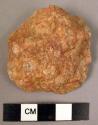 Small disc-shaped quartzite flake implement - apparently unused