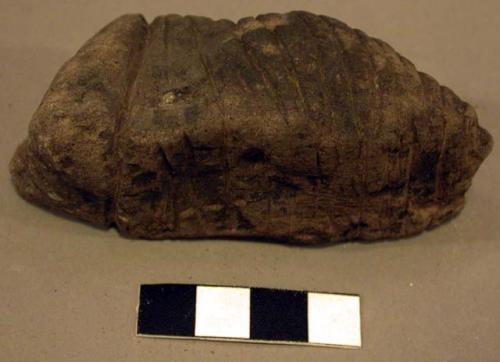 Scored stone object