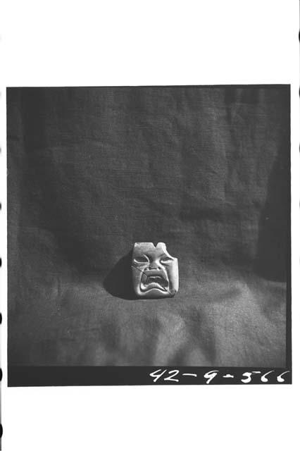 Small Olmec style stone pendant found in Utatlan. Knoke Collection