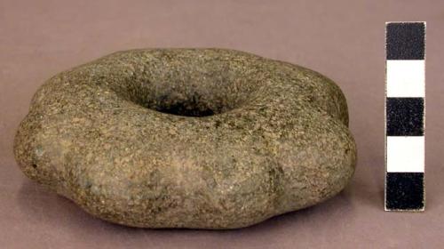 Ground stone mace head, flower or star shaped