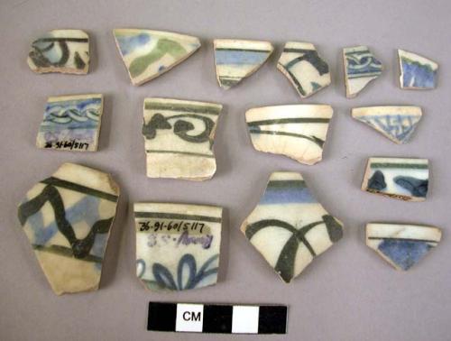 18 rim potsherds - blue to black on white glaze