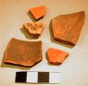 Black-on-red and red potsherds