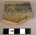 Potsherd - incised decorated smooth shiny red