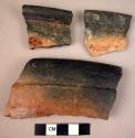 15 potsherds - shiny black and red surface outside, shiny black inside; thick ri
