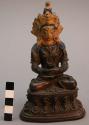Brass idol - painted face and headdress