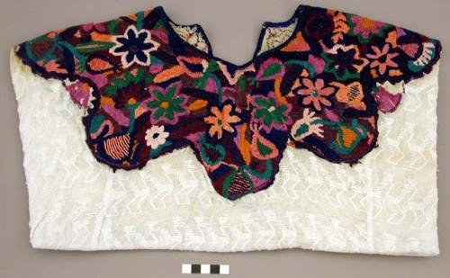 Huipil, embroidered top stitched onto loose-weave fabric
