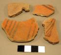 Black-on-red potsherds