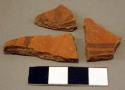 Black-on-red and red potsherds