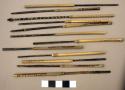 Arrows, carved wood points, most broken, reed shafts, sinew wraps