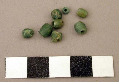 Ground stone beads, tubular, green stone