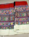 White and red embroidered and brocaded huipil