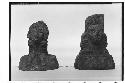 Two carved stone images on a pedestal