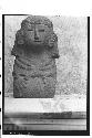 Stone figure (goddess) seated on heals