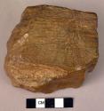 Double-ended hand adze of fossil wood