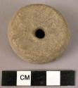 Polished stone spindle whorl