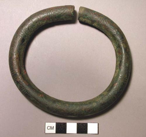 Bronze bracelet - unjoined, ornamented with geometric designs,typical