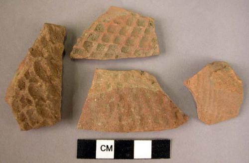 4 potsherds - red, relief