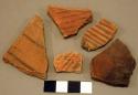 Red and black-on-red potsherds