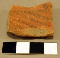 Black-on-red sherd, rim piece of a bowl