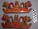 Carved and painted wooden coin holders used to decorate altars at +