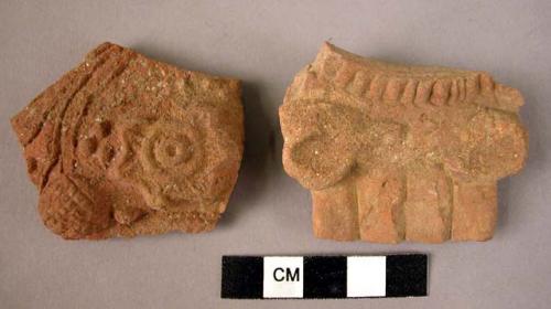 2 potsherds - red-brown, relief, moulded?