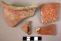 10 potsherds - shiny red-surfaced ware, mostly dark red