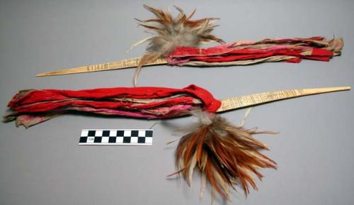 Pair of bone hair ornaments, decorated with incised designs and to +