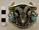 Cuff bracelet, silver band set with stones, large silver ram's head in center