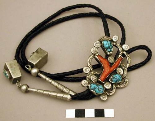 Bolo, silver with stamped decoration, inlaid with coral and turquoise