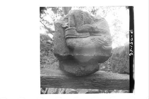 Sculptured stone with seated figure