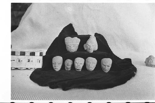 Seven Small, Unpainted  Pottery Figurine Heads