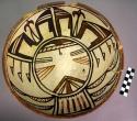 Bowl, polacca polychrome style c. int: kachina design; ext: slipped, no design.