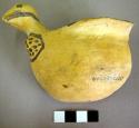 Fine geometric black on yellow pottery part of bird bowl