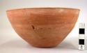 Pottery bowl (restored) - plain ware, tan to red brown (A1)