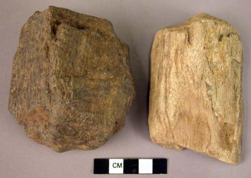 2 medium sized hand adzes of fossil wood