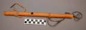 Plains flute. Made from reed split in half, wrapped with cloth and leather