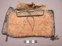 Bison hide flat bag, possibly from the Plains. Seed bead decoration and tinklers