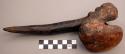Unclassified tool; carved wood; 1 end knobbed, other - tapered to point