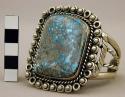 Cuff bracelet, open silver band  w/ lg. central turq. stone in ornate setting