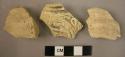 Ceramic rim and body sherds, white ware, molded, incised and ribbed designs