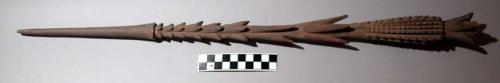 Projectile point, carved wood, conical tip, blunt, barbed, carved design, broken