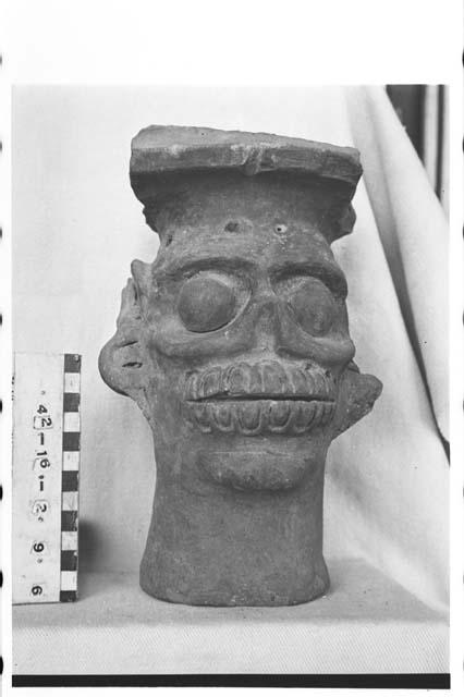 Annular base of incensario (?) "Tlaloc" face modelled. Smooth surface.